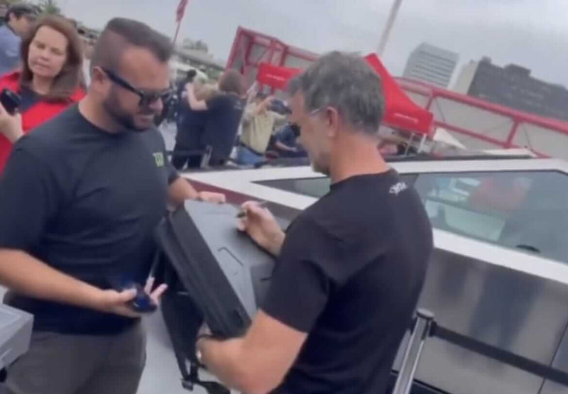 Tesla Design Guru Franz Autographs Mind-Blowing Cyberbackpack in Epic Meta Moment!