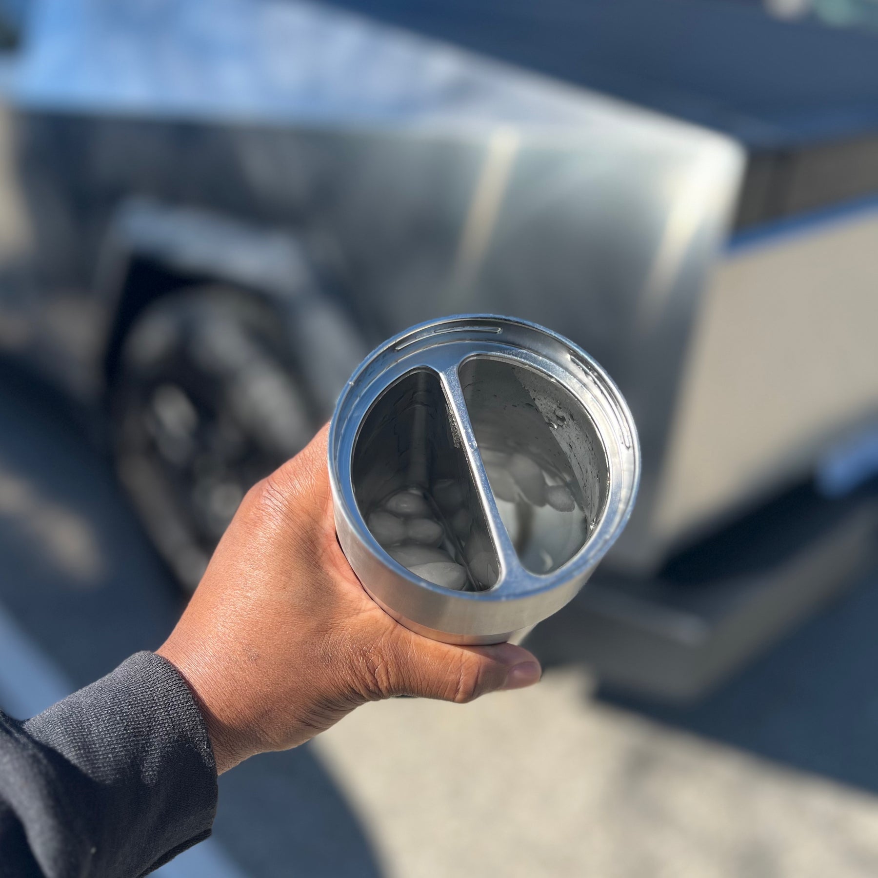 Cybercup 2 Drink Tumbler next to Tesla Cybertruck