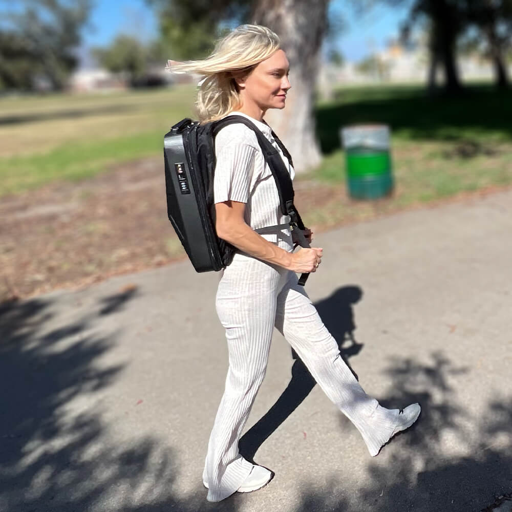 Girl walking while carrying cyberbackpack